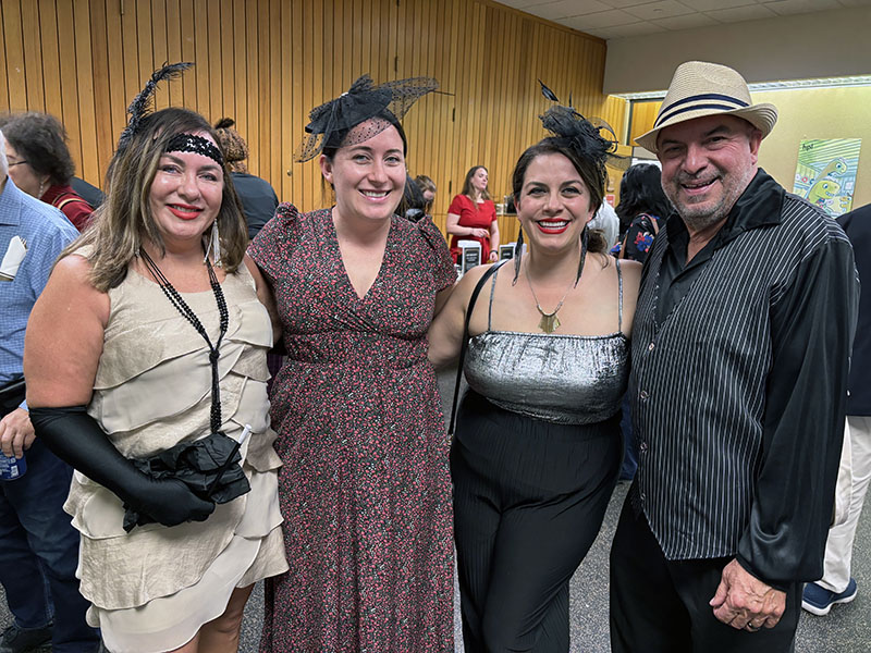 Head of Youth Services Angela Messaglia, second from left, welcomed family members from left, Susan Messaglia, Christina Messaglia Fulton, and John Messaglia, to the Homewood Public Library's 100th gala. (Marilyn Thomas/H-F Chronicle)