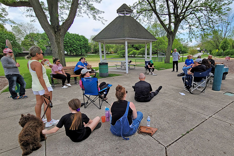 Residents gather Saturday at Leavitt Park in Flossmoor to learn more about the proposed storm water detention basin near Heather Hill School. (Eric Crump/H-F Chronicle)