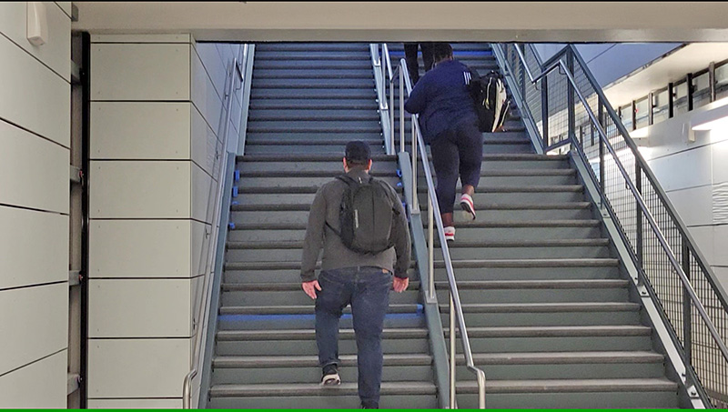 Commuters make their way up the new stairway to the Metra boarding platform at the Homewood train station early Monday. (Eric Crump/H-F Chronicle)