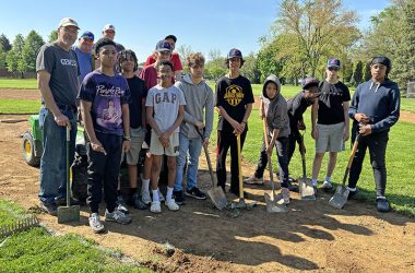 It was a team effort at Lions Park where players and coaches in the Babe Ruth 14U team worked on their home ball field. (Marilyn Thomas/H-F Chronicle)
