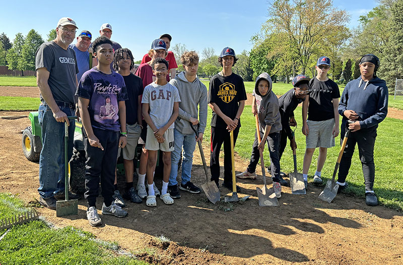 It was a team effort at Lions Park where players and coaches in the Babe Ruth 14U team worked on their home ball field. (Marilyn Thomas/H-F Chronicle)