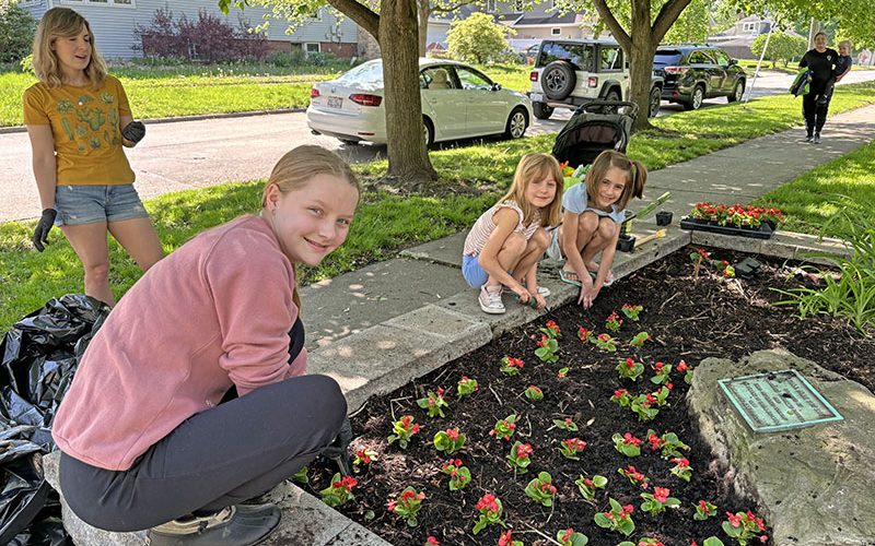 Cedar Park volunteers, from left, Lucy Klika, Emilee DiCicco (standing), and her daughters Elise and Claira DiCicco.