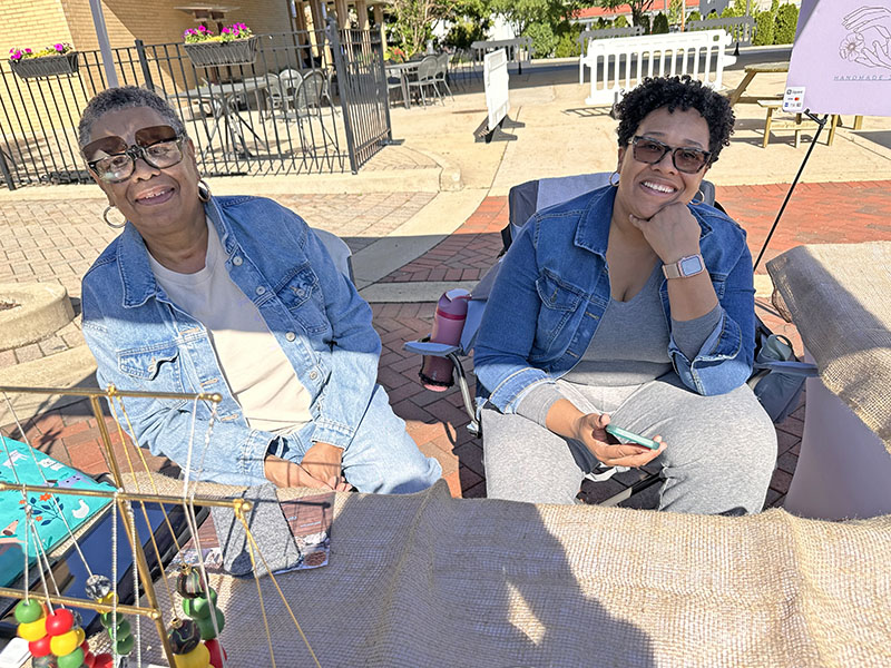 Jontil Grubbs (left) and her mom Donna Moran team up to sell Moran’s colorful jewelry. (Karen Torme Olson/H-F Chronicle)