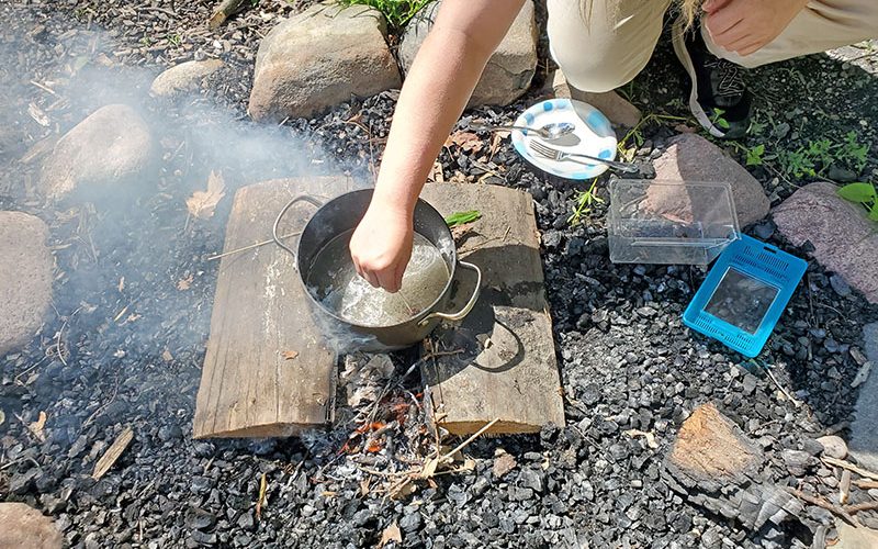 A cicada is turned into a warm snack by dipping it in boiling sugar water. (Chris Weber/H-F Chronicle)