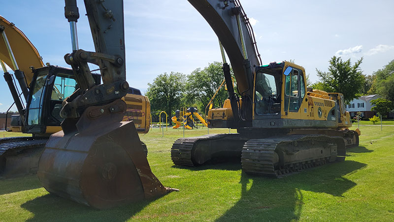 Machinery is in place Wednesday, June 12, in preparation for work to begin on a storm water detention basin near Heather Hill School. (Eric Crump/H-F Chronicle)