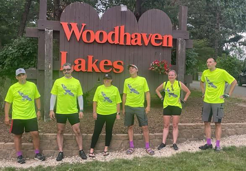 From left: Greg Castady, Brian Shores, Meghan Sorensen, Chris Dedo, Karen Cordes and Dana Noble prepare to relax at the end of the 100-mile trek. (Provided photo)