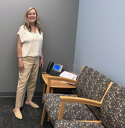 Kim Bartolomucci in what will be the waiting room for people who come to the lab for help. She said she can’t wait until the furniture arrives and Trent Bartolomucci Behavioral Health Lab goes live on June 27. (Karen Torme Olson/H-F Chronicle)