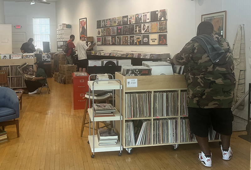 A customer browses vinyl records at The Conservatory, which is celebrating its five year anniversary this month. (Nick Ulanowski/H-F Chronicle)
