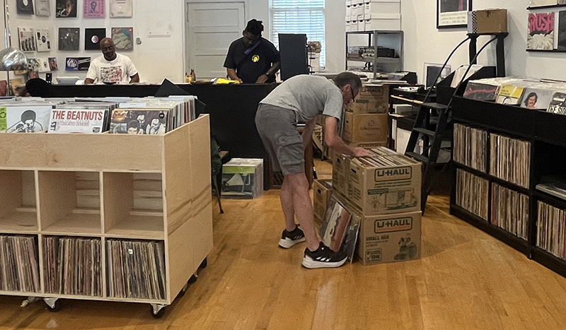 A customer browses vinyl records at The Conservatory, which is celebrating its five year anniversary this month. (Nick Ulanowski/H-F Chronicle)