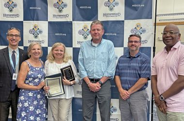 Deb Havighorst, third from left, who resigned from the District 153 school board, was bid farewell by colleagues, from left, Superintendent Scott McAlister, school board president Shelly Marks, and board members Alex Brosch, Jim Schmidt and Ron Zinnerman. (Marilyn Thomas/H-F Chronicle)