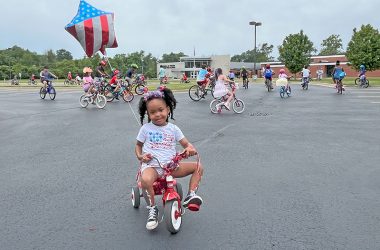 Nadia Neish, 4, gets ready to start her first Flossmoor 4th of July parade. (Nuha Abdessalam/H-F Chronicle)