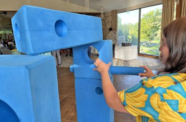 Kiera Kuper seen figuring out STEM puzzle activity. (Nuha Abdessalam/H-F Chronicle)