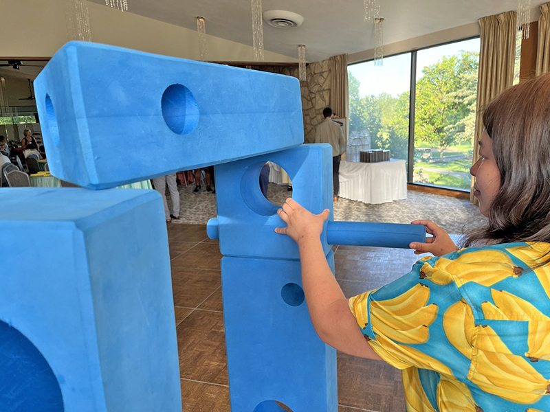 Kiera Kuper seen figuring out STEM puzzle activity. (Nuha Abdessalam/H-F Chronicle)