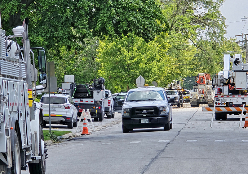 Multiple utility crews descend upon the area of Willow Road and Marshfield Avenue Friday afternoon, July 19, to work on getting power restored after the neighborhood was hit by an EF-1 tornado on Monday, July 15. (Eric Crump/H-F Chronicle)