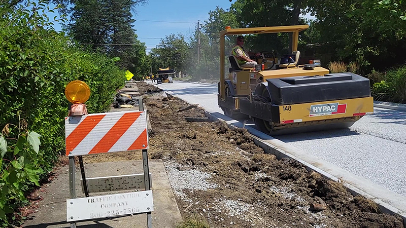 Crews make final preparations July 31 before starting to repave Brumley Drive in Flossmoor. (Eric Crump/H-F Chronicle)