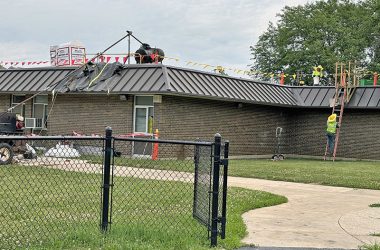 Yellow and red flags marked a work area at Churchill School where crews from Riddiford Roofing Co. replaced the leaking roof. (Marilyn Thomas/H-F Chronicle)