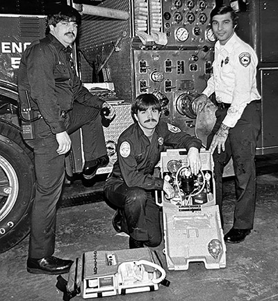 Firefighter/paramedics in the 1970s, from left, Kevin Welsh, Jody Applegate and Dan Rossi show off some of their latest equipment. (Provided photo)
