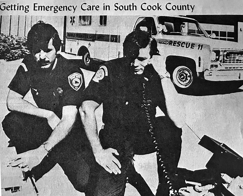Homewood paramedics Greg Knoll, left, and Dave Danielson appear in a photo used for a public education brochure about emergency medical services. (Provided photo)