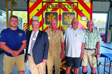 Andrew Sline, left, Homewood Fire Department's newest paramedic, with three of Homewood's first paramedics from 50 years ago, from second left, Charles "Chip" Woyner, Dave Danielson and Greg Knoll, with Fred Sierzenga right, who chaired fundraising drives to purchase the village's first ambulances. (Marilyn Thomas/H-F Chronicle)
