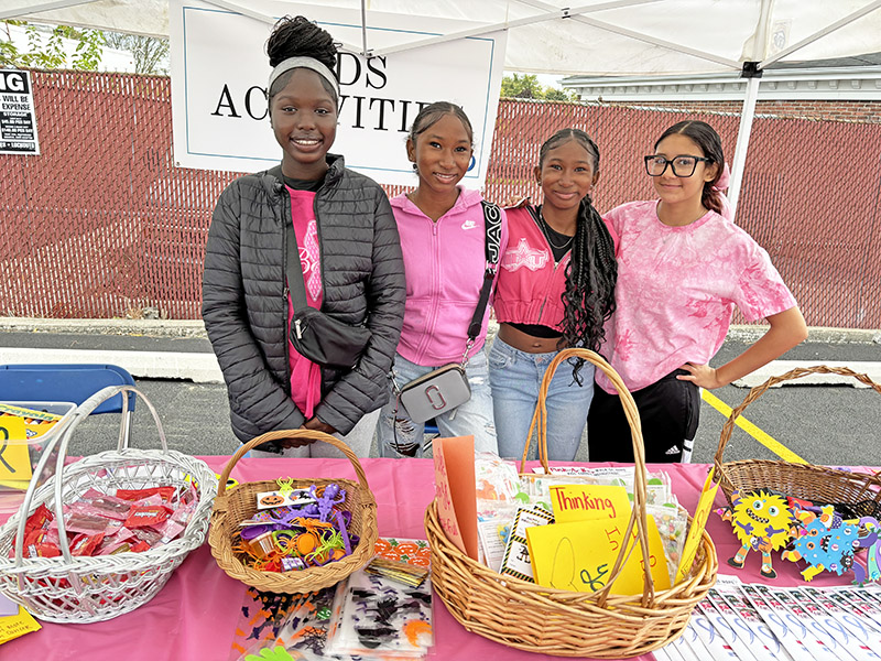 Members of the Homewood-Flossmoor High School Key Club, from left, Danielle Brown, Jakayla Roper, Janiah Roper and Aiyana Ocampo, manned the kids table filled with crafts and trinkets. (Marilyn Thomas/H-F Chronicle)