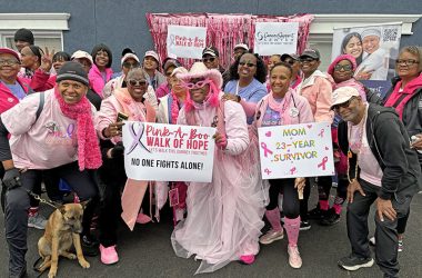 Members of the Sistas of Hope, a support group for Black women with a cancer diagnosis, gather for a group photo at the Pink-A-Poo Walk. (Marilyn Thomas/H-F Chronicle)