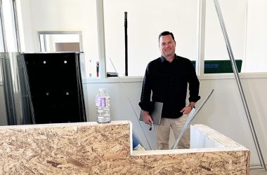 Flossmoor Animal Hospital co-owner Chris Ormsby inside what will be the new waiting room exclusively for pet boarding and grooming at Flossmoor Animal Hospital. (Nick Ulanowski/H-F Chronicle)