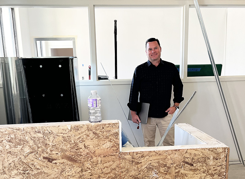 Flossmoor Animal Hospital co-owner Chris Ormsby inside what will be the new waiting room exclusively for pet boarding and grooming at Flossmoor Animal Hospital. (Nick Ulanowski/H-F Chronicle)