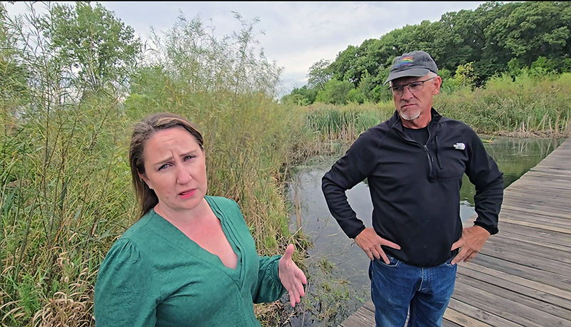 Environmental activist Liz Varmecky of South Suburbs for Greenspace discusses her efforts to gather information from various government entities that have jurisdiction over water flowing into Prairie Lakes at Izaak Walton Preserve. (Eric Crump/H-F Chronicle)