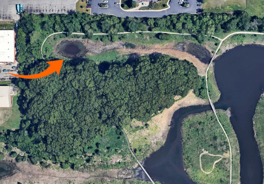 The red arrow shows the location of the pond in the northwest corner of Izaak Walton Preserve that a test shows contains toxins. (Provided image)