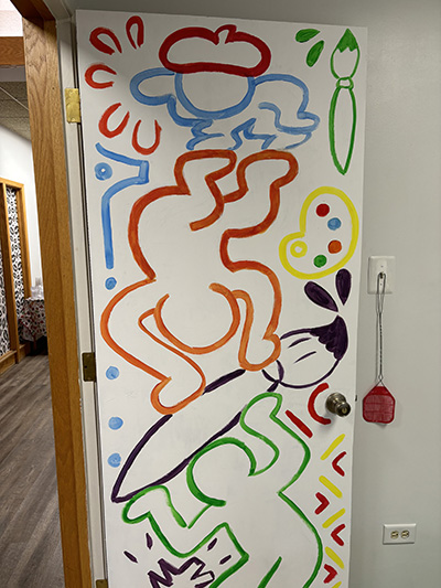 Guests are welcomed to Art Culture Studios through a colorful door. (Marilyn Thomas/H-F Chronicle)