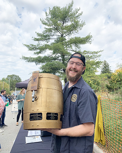 Jake LaDuke, brewmaster at Flossmoor Station Restaurant & Brewery, proudly displays his bourbon barrel prize for his award-winning chocolate and cherries stout. (Provided photo)
