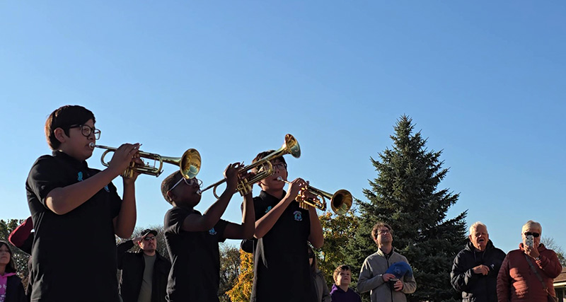 James Hart School musicians sound taps during the Veterans Day flag-raising ceremony. (Eric Crump/H-F Chronicle)