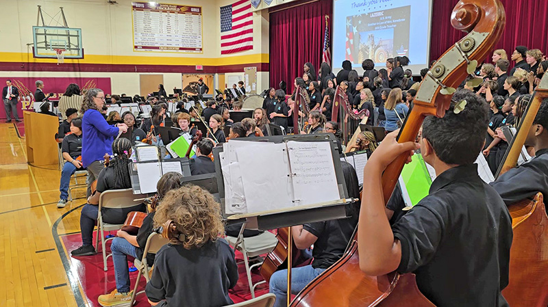 The James Hart orchestra, band and choir prepare to perform for veterans, staff and students during the school's annual Veterans Day event. (Eric Crump/H-F Chronicle)