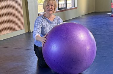 Shihan Diane Wallander on the flexible floor in her Chicago Minami Dojo. The padded floor with spring underlayment will insure “soft” landings during Jujutsu classes; the ball is used for certain training exercises. (Karen Torme Olson/H-F Chronicle)