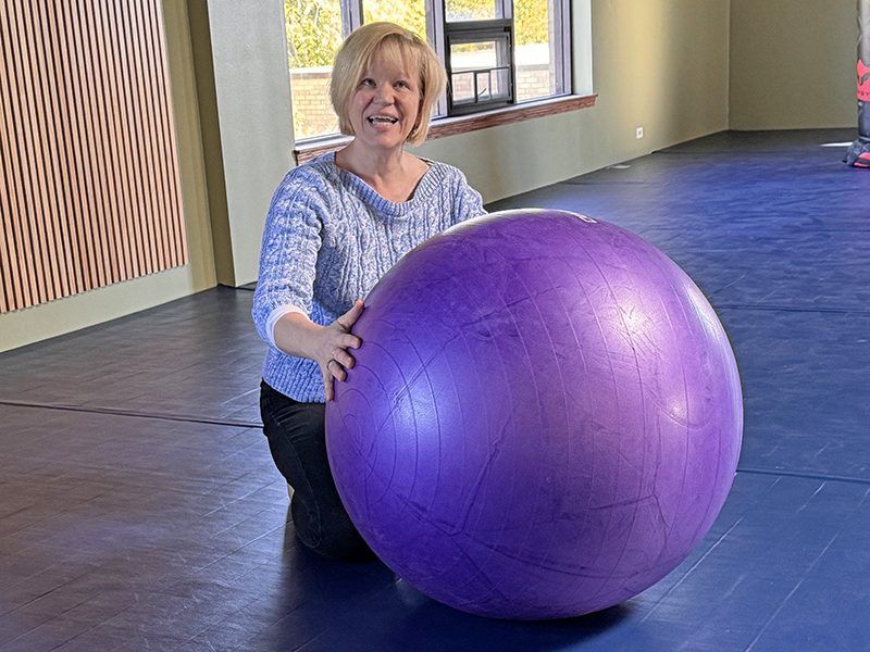 Shihan Diane Wallander on the flexible floor in her Chicago Minami Dojo. The padded floor with spring underlayment will insure “soft” landings during Jujutsu classes; the ball is used for certain training exercises. (Karen Torme Olson/H-F Chronicle)
