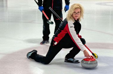 Curling instructor Debbie Buchanan demonstrates how to throw, or push, the curling stone. (Provided photo)