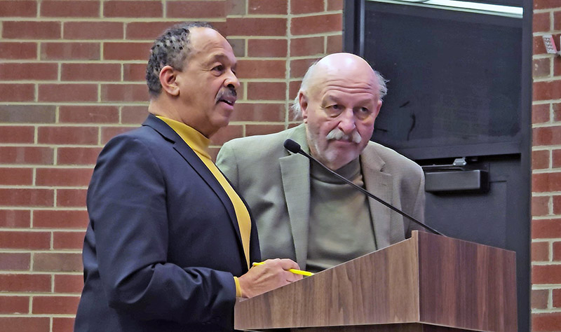 Developers Byron Gregory, left, and Gene Steinmarch explain their proposal to build townhouses and a cafe in the 2600 block of Flossmoor Road, land that the village has been trying to market for redevelopment for more than two decades. (Eric Crump/H-F Chronicle)