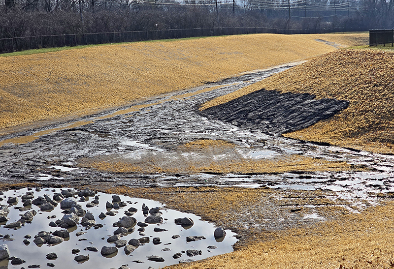 A photo taken Dec. 30 shows less water pooled in the Heather Hill detention basin. The area received about an inch of rain the day before. (Eric Crump/H-F Chronicle)