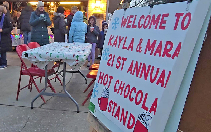 Sisters Kayla and Mara Winfrey of Homewood hold their 21st annual hot chocolate stand on Dec. 13 to benefit Toys for Tots. (Eric Crump/H-F Chronicle)