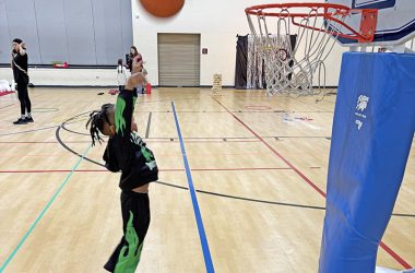 Masai McEwen, 5, had great aim hitting the basket during play time before the Noon Year's Eve celebration at the H-F Park District Sports Complex on Dec. 31. (Marilyn Thomas/H-F Chronicle)