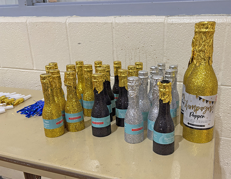 Mini champagne bottles filled with confetti were handed out to kids at the Noon Year's Eve celebration sponsored by the H-F Park District Dec. 31. (Marilyn Thomas/H-F Chronicle)