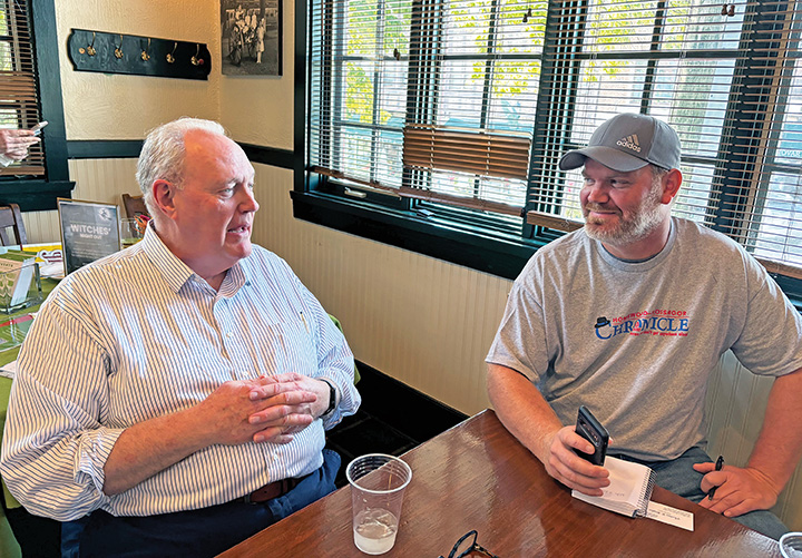 Reporter Chris Weber, right, interviews local attorney and long-time Chronicle advertiser Tom Brabec during the newspaper's 10th anniversary open house at Flossmoor Station Restaurant & Brewery on Oct. 5. (Chronicle file photo)