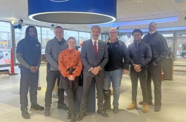 Fort of Homewood team members, from left, Bradley Reed, Jeff Moyers, Sarah Lovitt, owner Steve Phillipos, Bob Cuban, Samuel Bailey and Daniel Wood, inside the remodeled show floor. (Nick Ulanowski/H-F Chronicle)