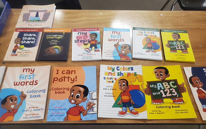 Books written by H-F High School wrestling coach and teacher Evan Roberts are available for kids to read during the Readers are Leaders event Jan. 20. (Chris Weber/H-F Chronicle)
