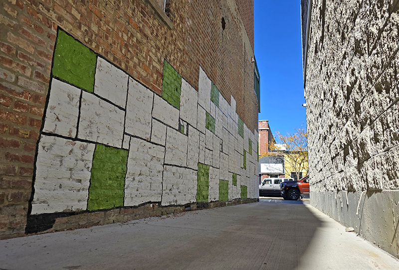 The mural by Nate Otto begins to take shape as seen in this photo from Oct. 24. (Eric Crump/H-F Chronicle)