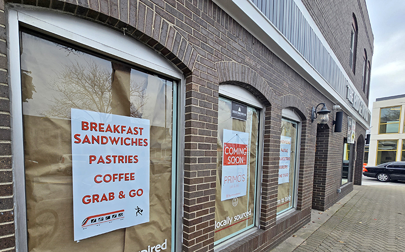 Signs on the windows promote menu items planned for Primo's Deli at 2057 Ridge Road, which will be opening soon. (Eric Crump/H-F Chronicle)
