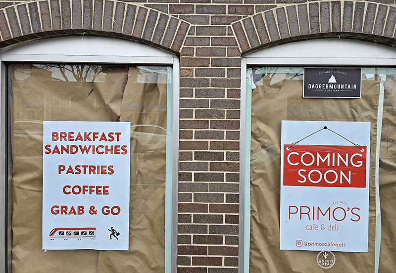 Signs on the windows promote menu items planned for Primo's Deli at 2057 Ridge Road, which will be opening soon. (Eric Crump/H-F Chronicle)