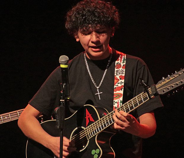 Angel Fernandez performs on guitar during H-F talent show. (Emmanuel Wright/provided photo)