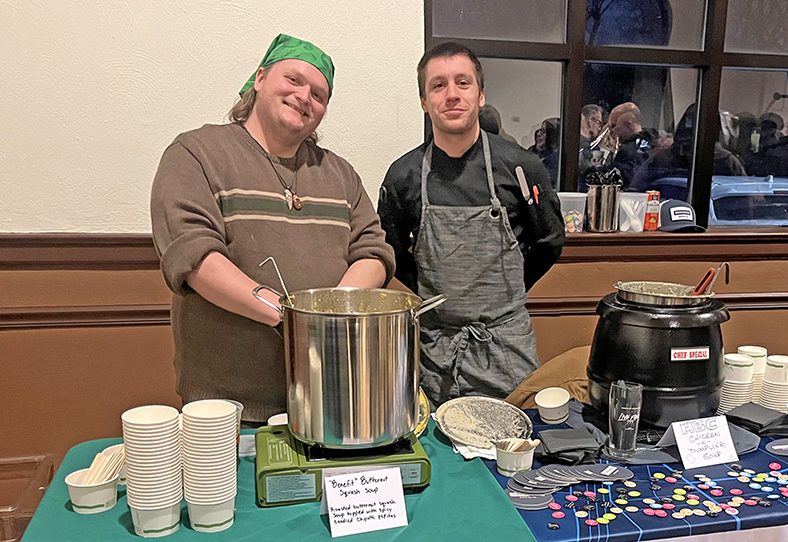 Independent chef Stef Anderson, left, and Homewood Brewing Company chef Gabriel Seymour share a booth at Soup for the Soul. (Nick Ulanowski / H-F Chronicle)