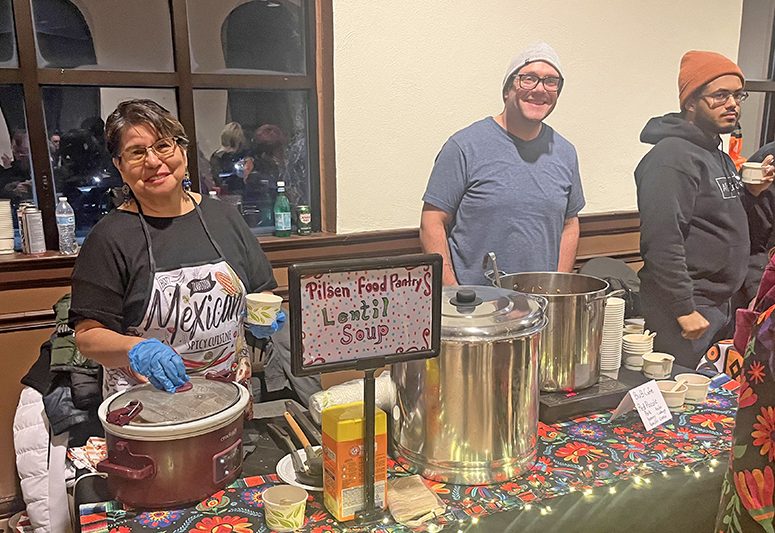 Pilsen Food Pantry Lupe Raymundo chef, far left, serves lentil soup. (Nick Ulanowski/H-F Chronicle)